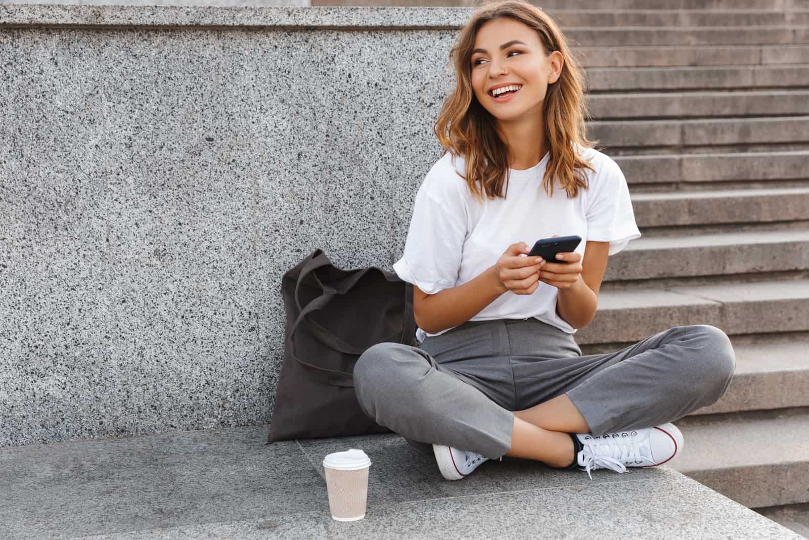 young woman sitting outside