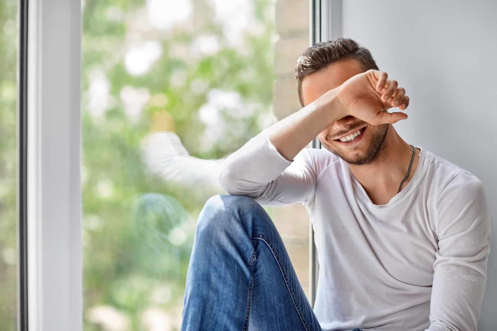 man sitting by window