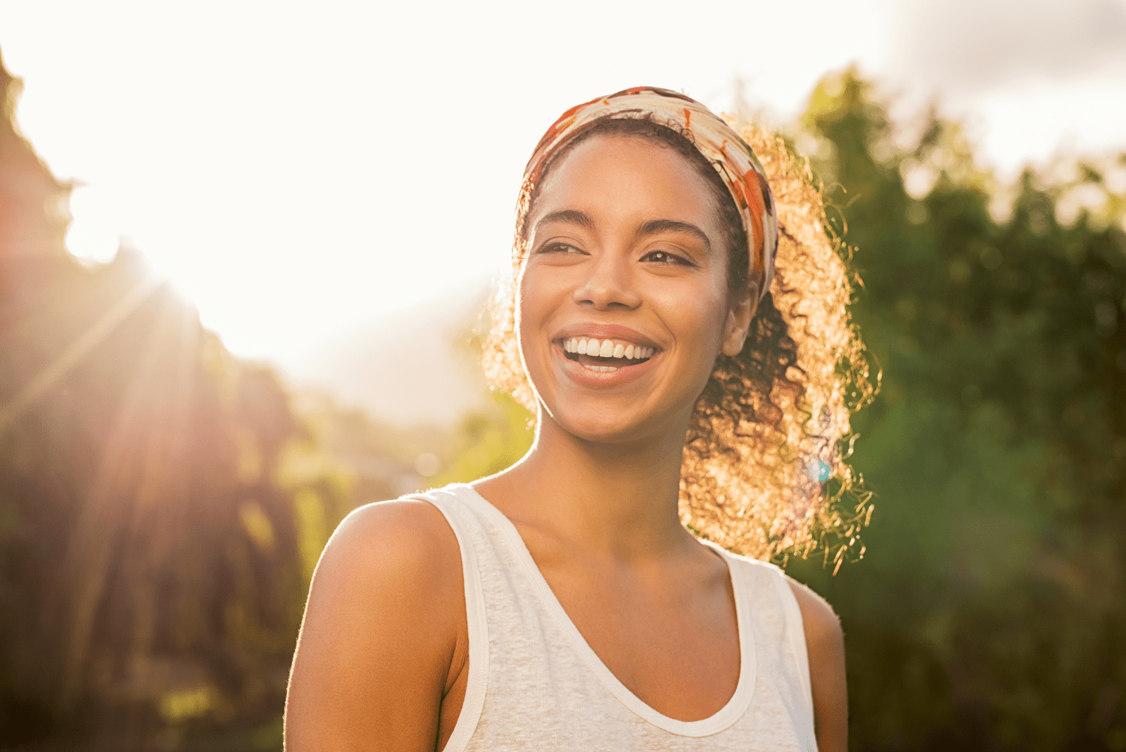 smiling woman with tied hair