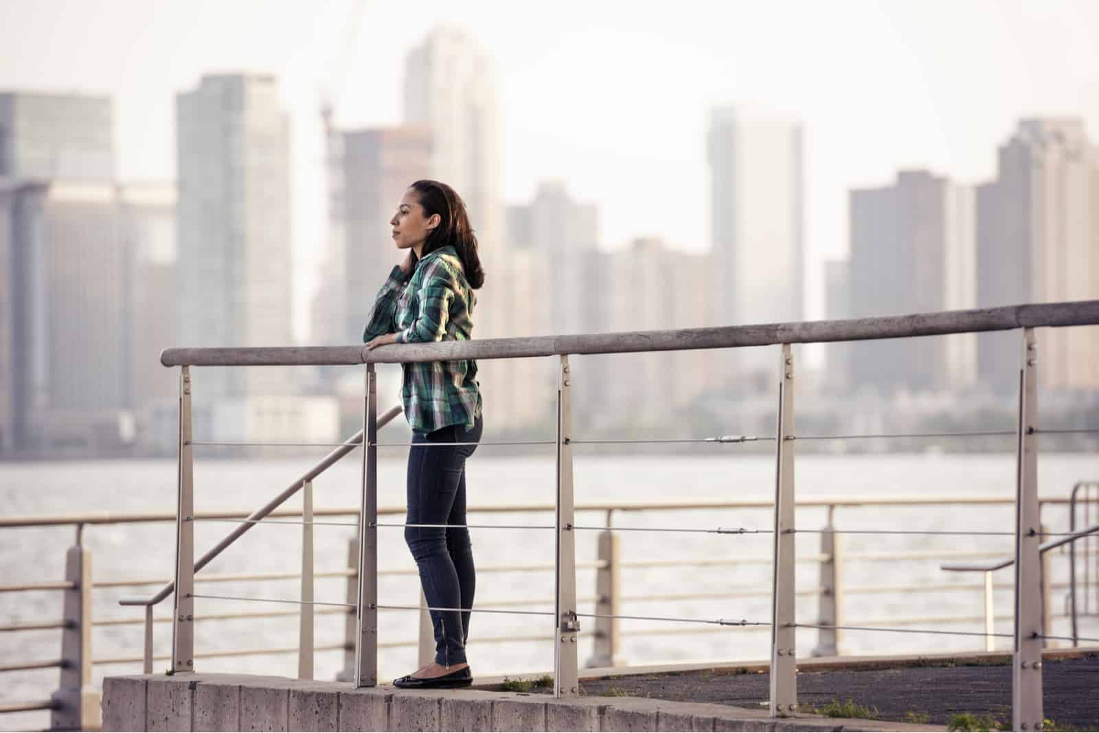 woman standing outside looking into distance