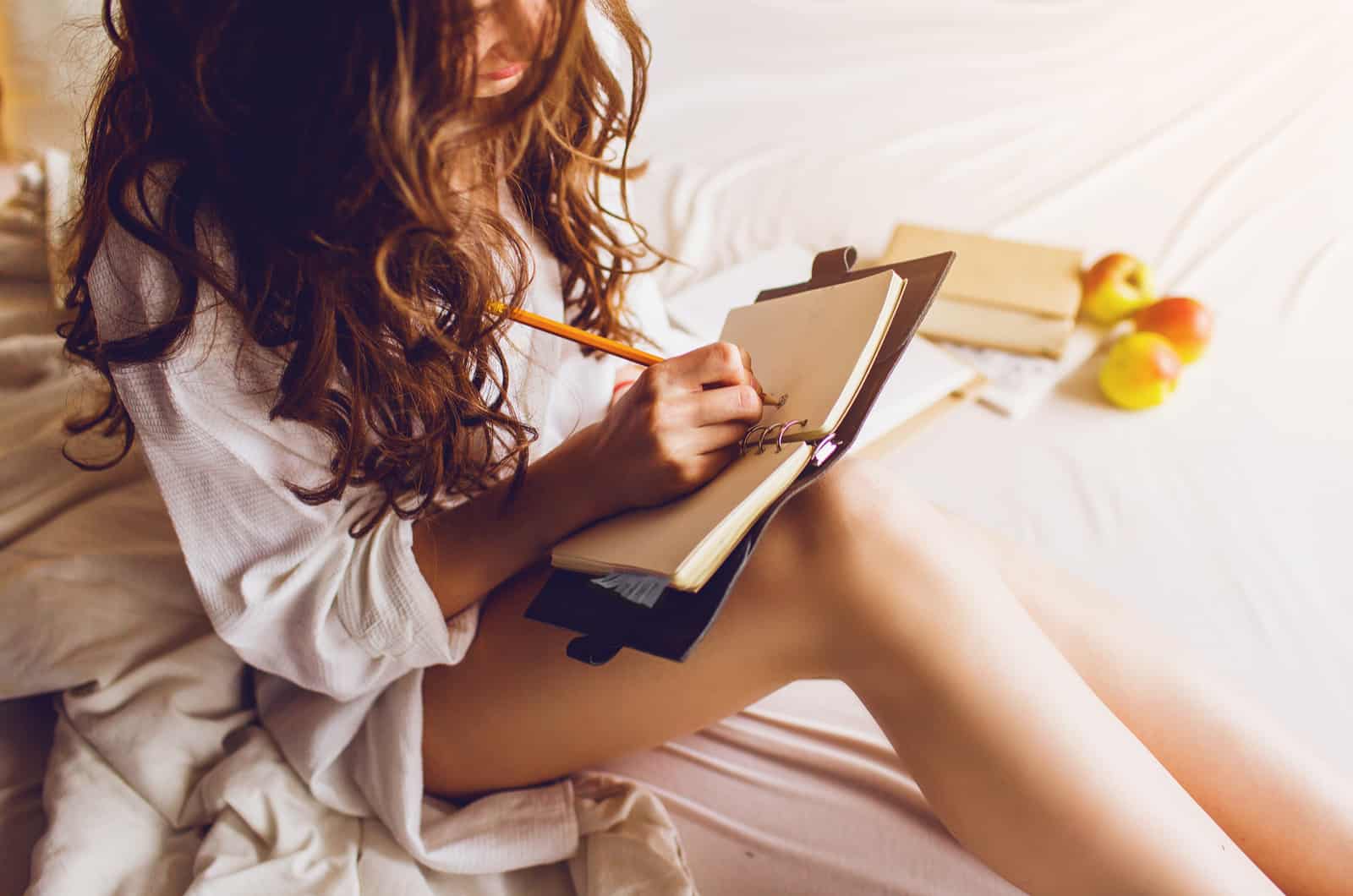 woman writing in notebook