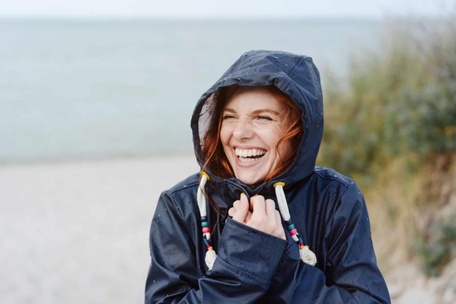 Laughing happy young woman