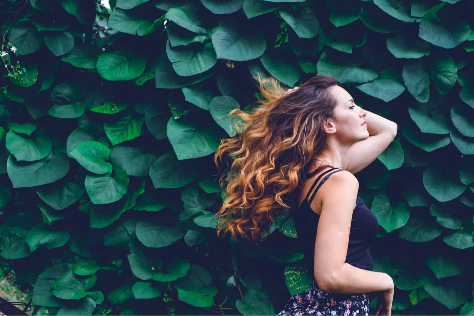 Running girl with beautiful curly hair