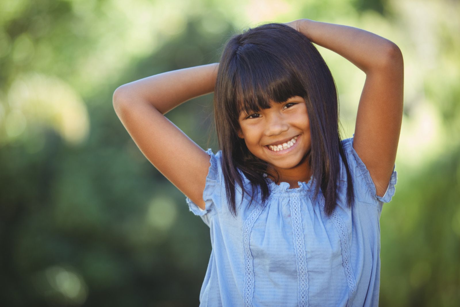 Cute little girl in the park on a sunny day
