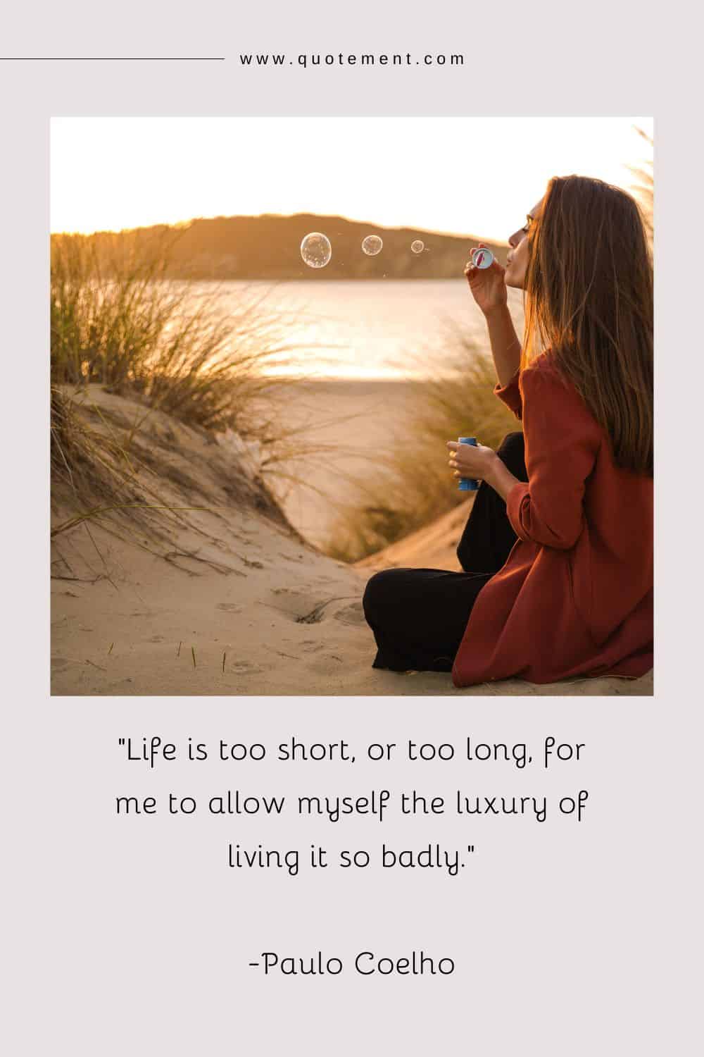 a girl sitting on the beach, releasing soap bubbles into the breeze