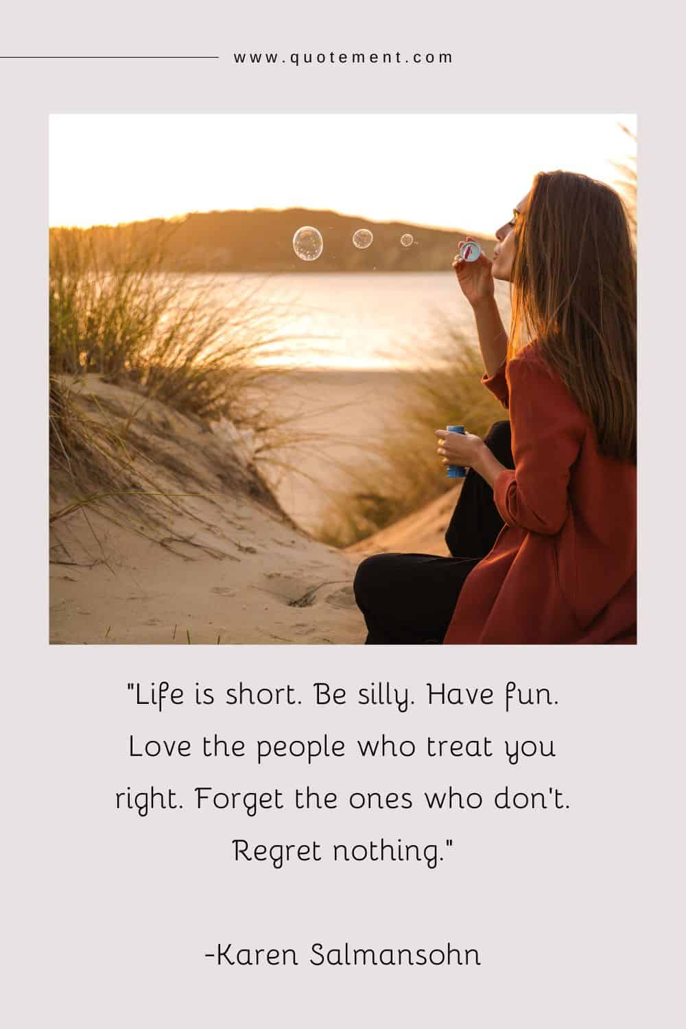 a long-haired young woman blows soap bubbles on the beach