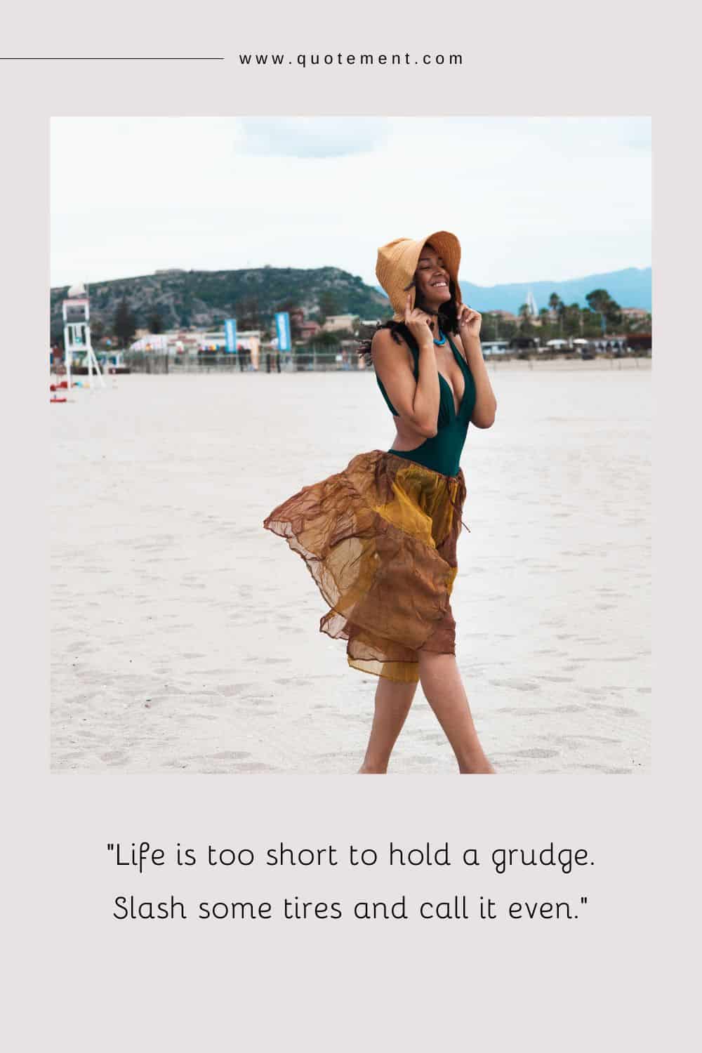 a young girl on the beach, hands holding her hat, enjoying the sunny day