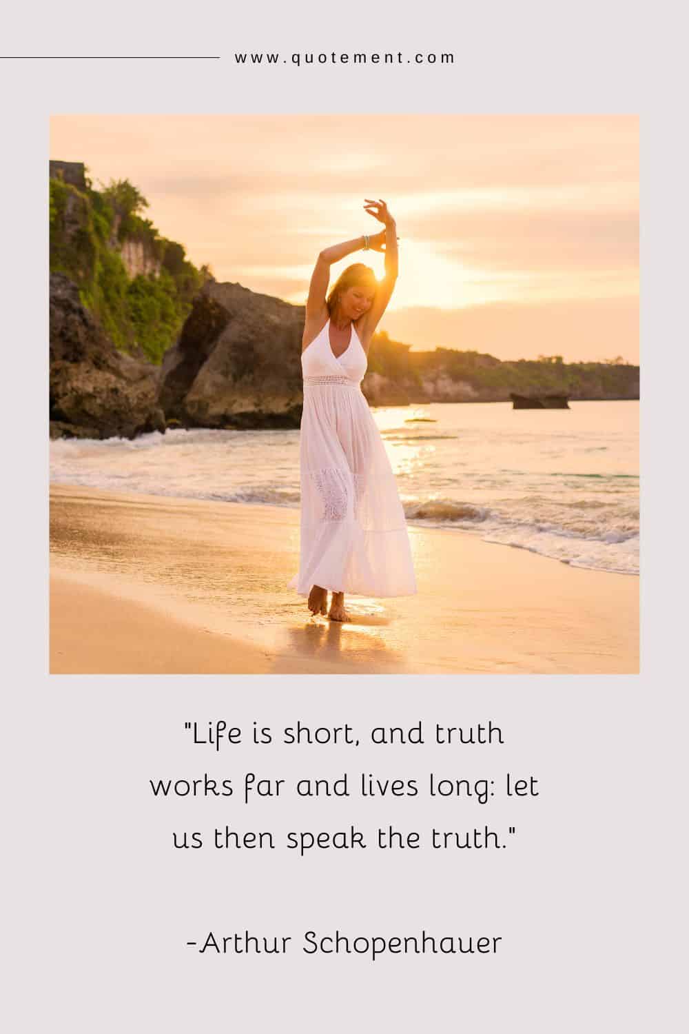 a young woman with arms raised, embracing the beauty of the beach in her elegant white dress