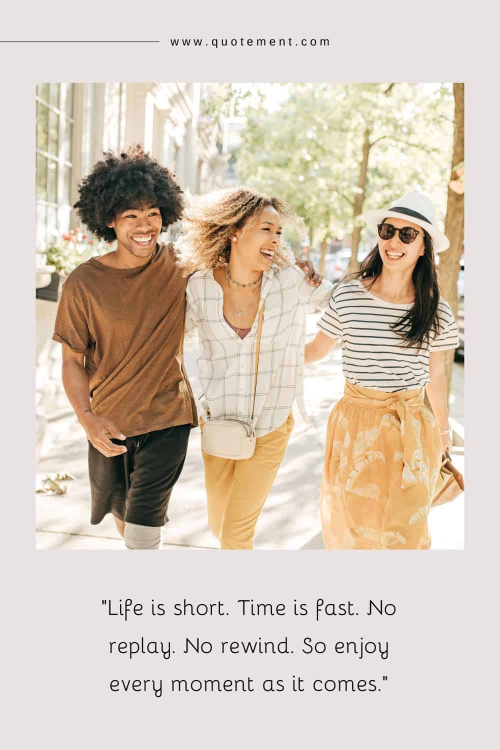 three friends walking and hugging, showing their smiles