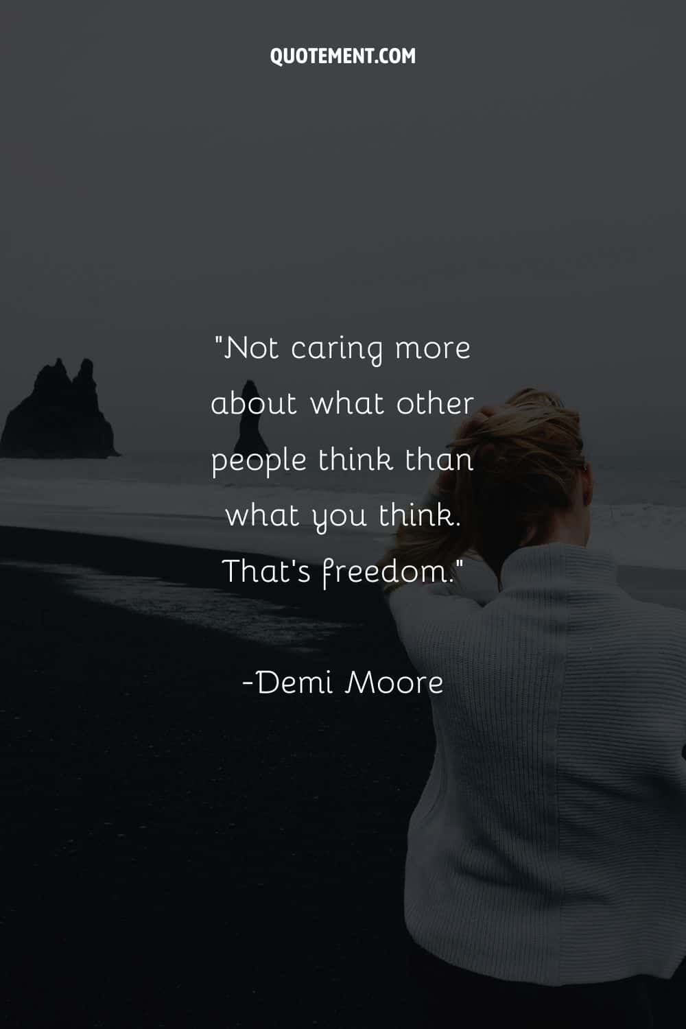 Woman by the water, wearing white representing a quote about freedom.