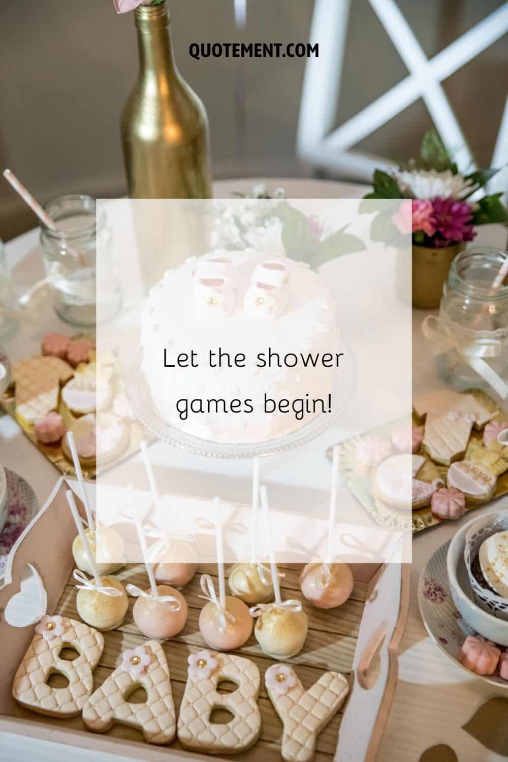 a table with baby shower cake and sweets