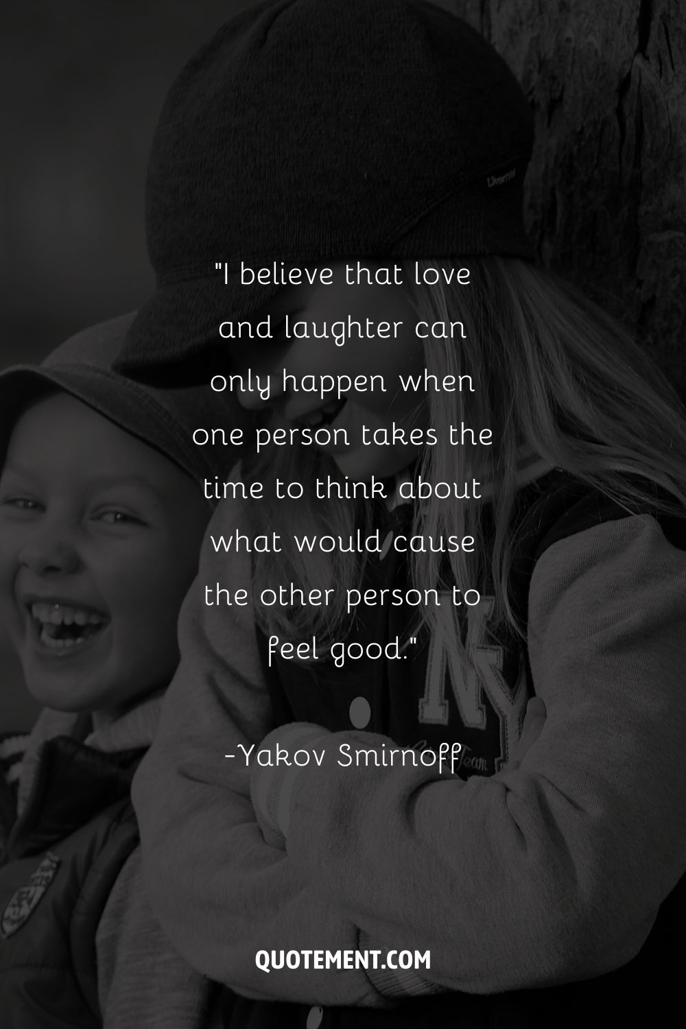 boy and girl in caps, sharing smiles