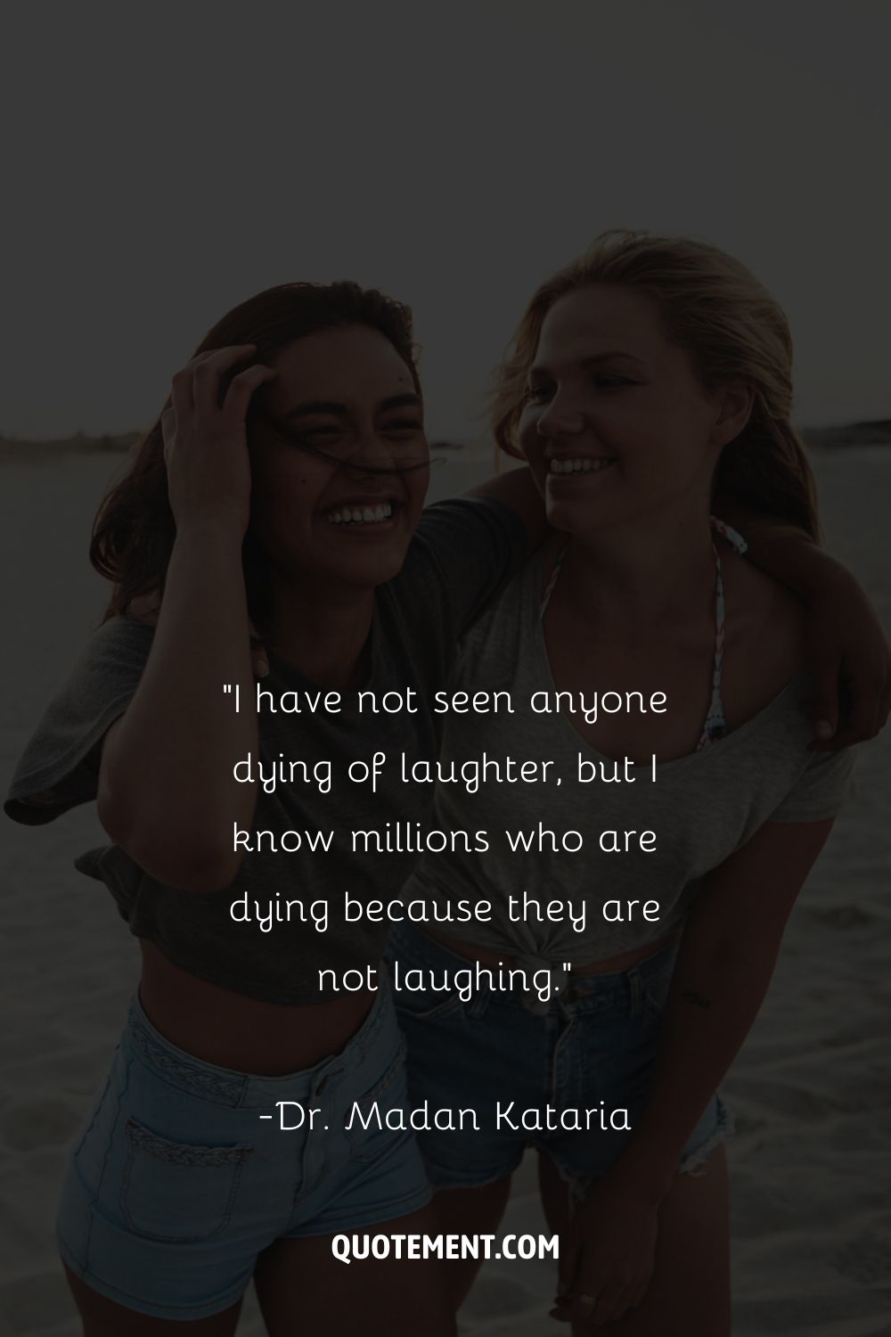 two girls in a happy hug at the beach