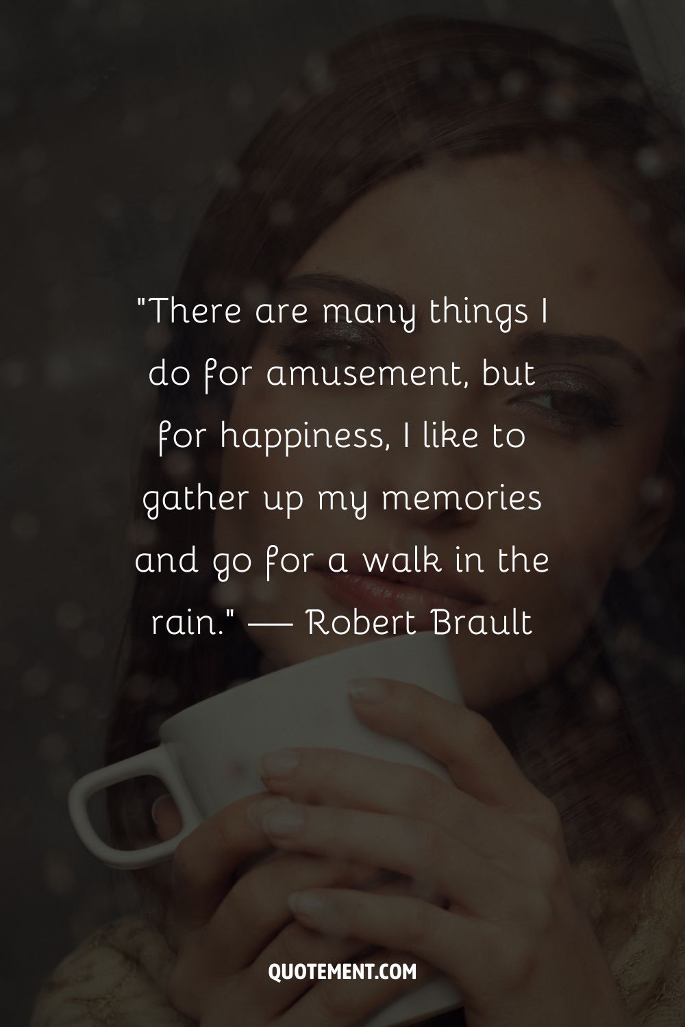 A woman enjoying a warm drink as raindrops streak down the window
