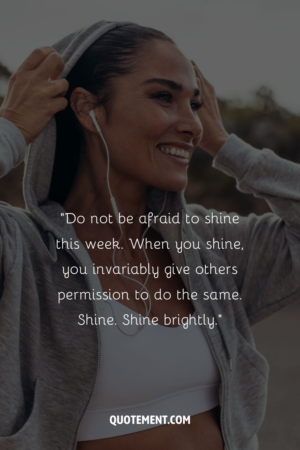 A smiling young woman with headphones representing a positive new week quote